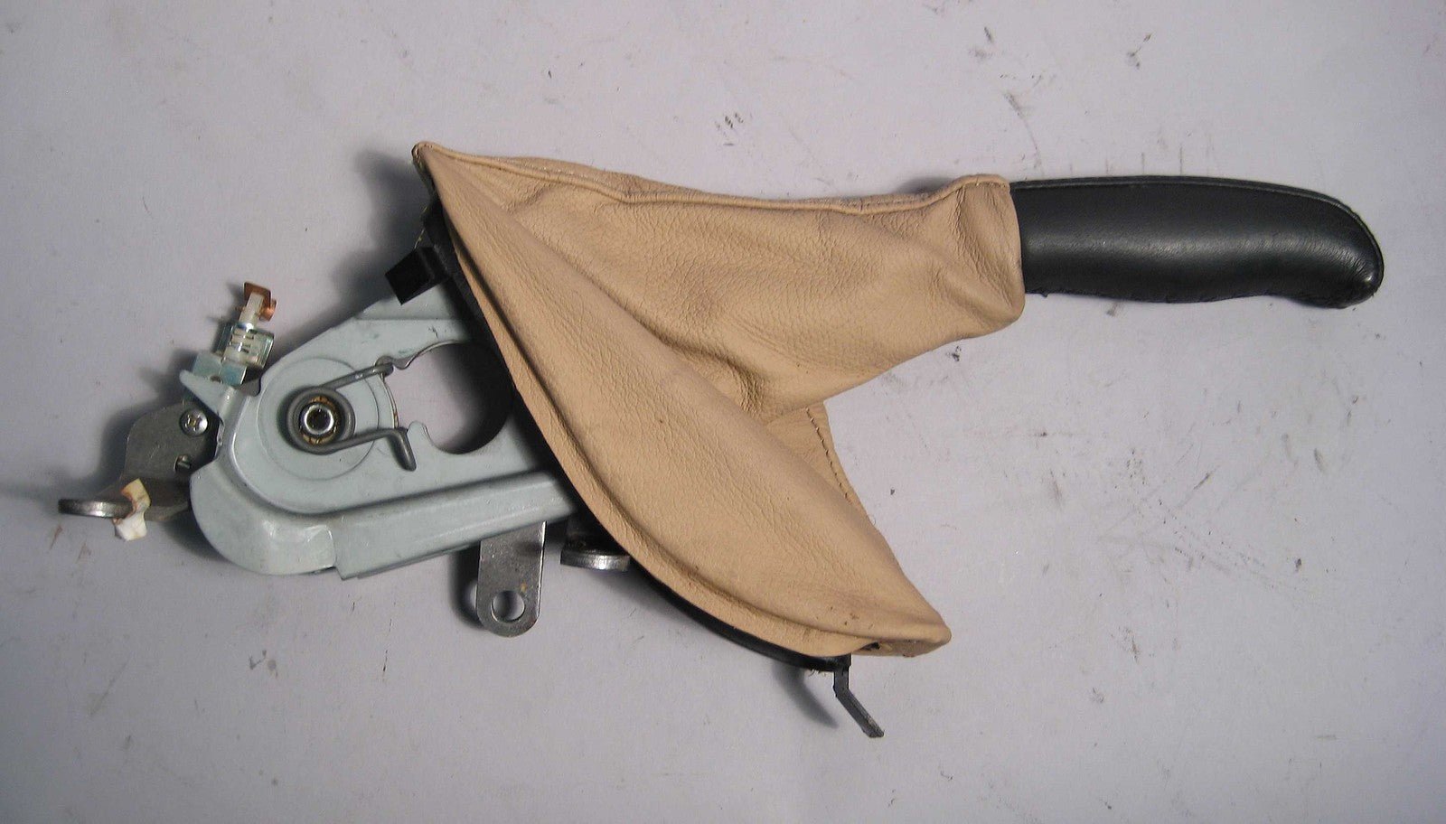 57_323927ca-b71f-44cf-b4b5-55bd6c505271.jpg BMW E39 Emergency Handbrake Lever and Boot Beige Leather 1997-2003 USED OEM - Image 1