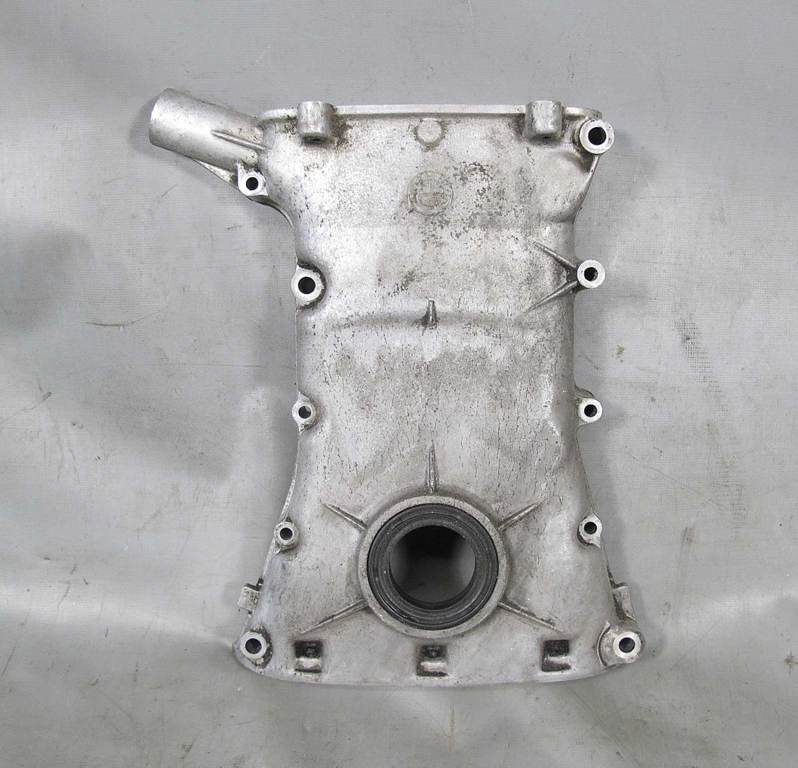 57_62f6c4cf-cc9b-42e7-b927-591505970c01.jpg BMW M30 6-Cylinder 3.2L 3.5L Lower Main Timing Cover Case Seal 1975-1993 USED OE - Image 1