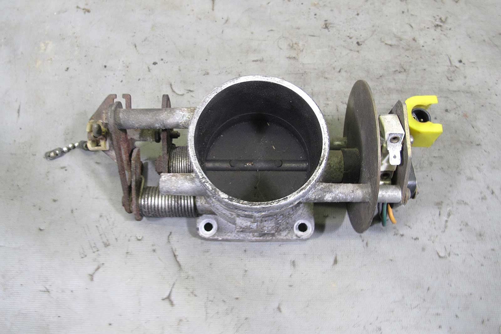 57_e186211b-b9ee-4021-a98a-7571fc0bd65e.jpg 1980-1986 BMW E23 745i M106 Turbo Factory Throttle Body Housing Assembly OEM - Image 1